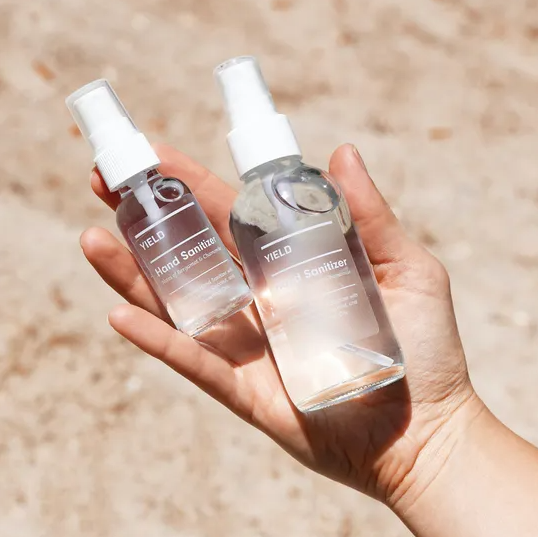 hydrating hand sanitizer in glass bottle